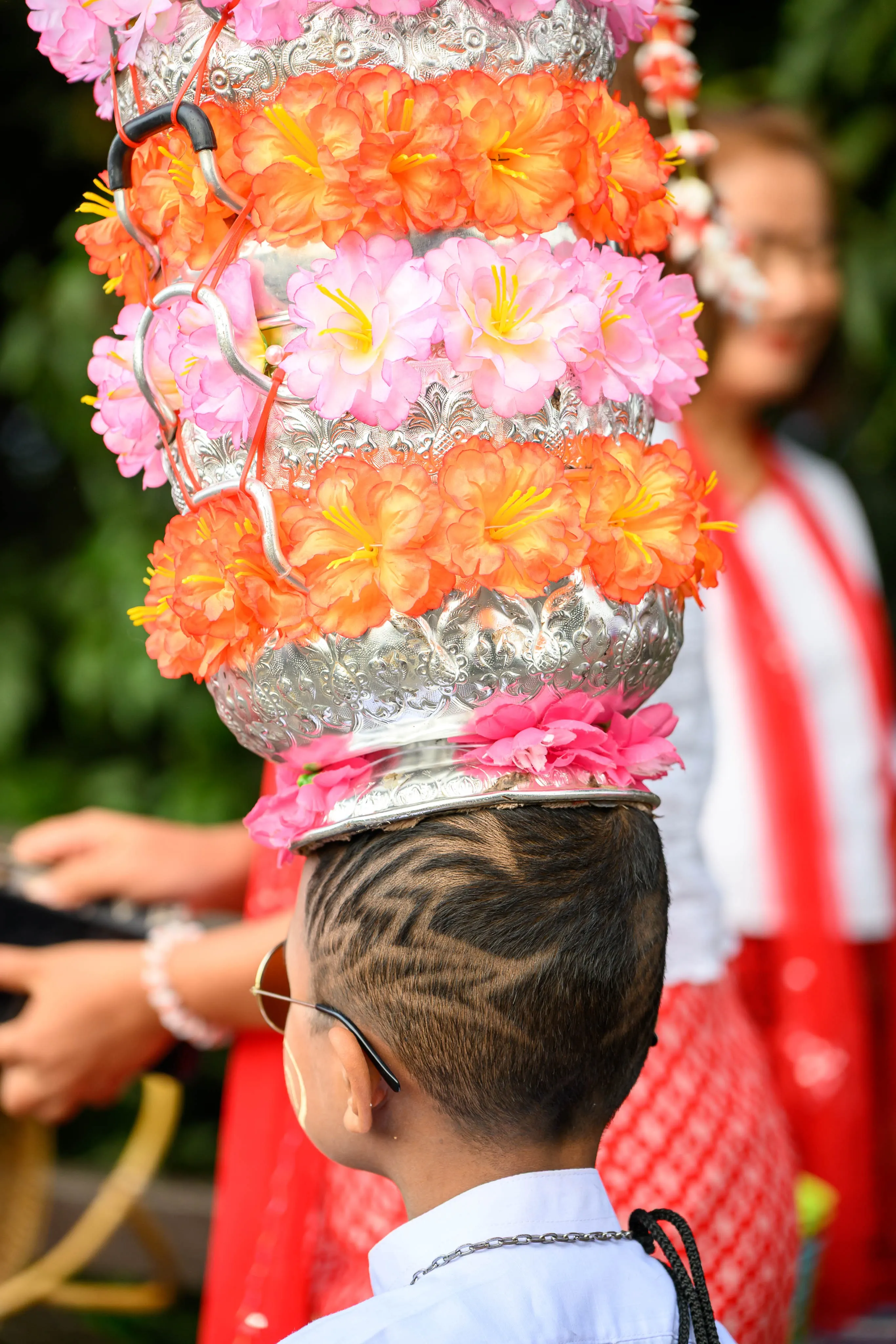 A close-up of a colorful floral headdress at a festival