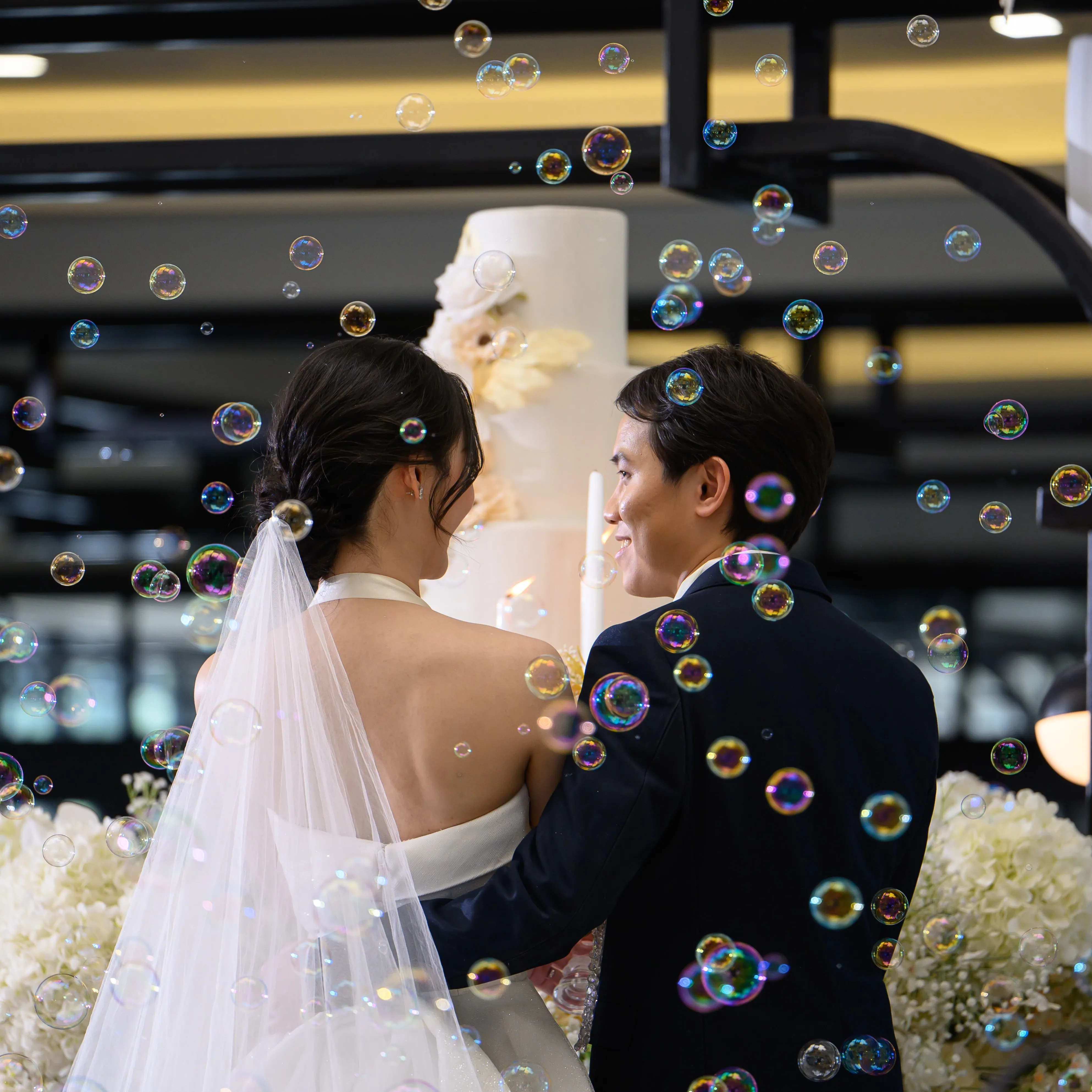 A couple sharing a moment as bubbles float around them