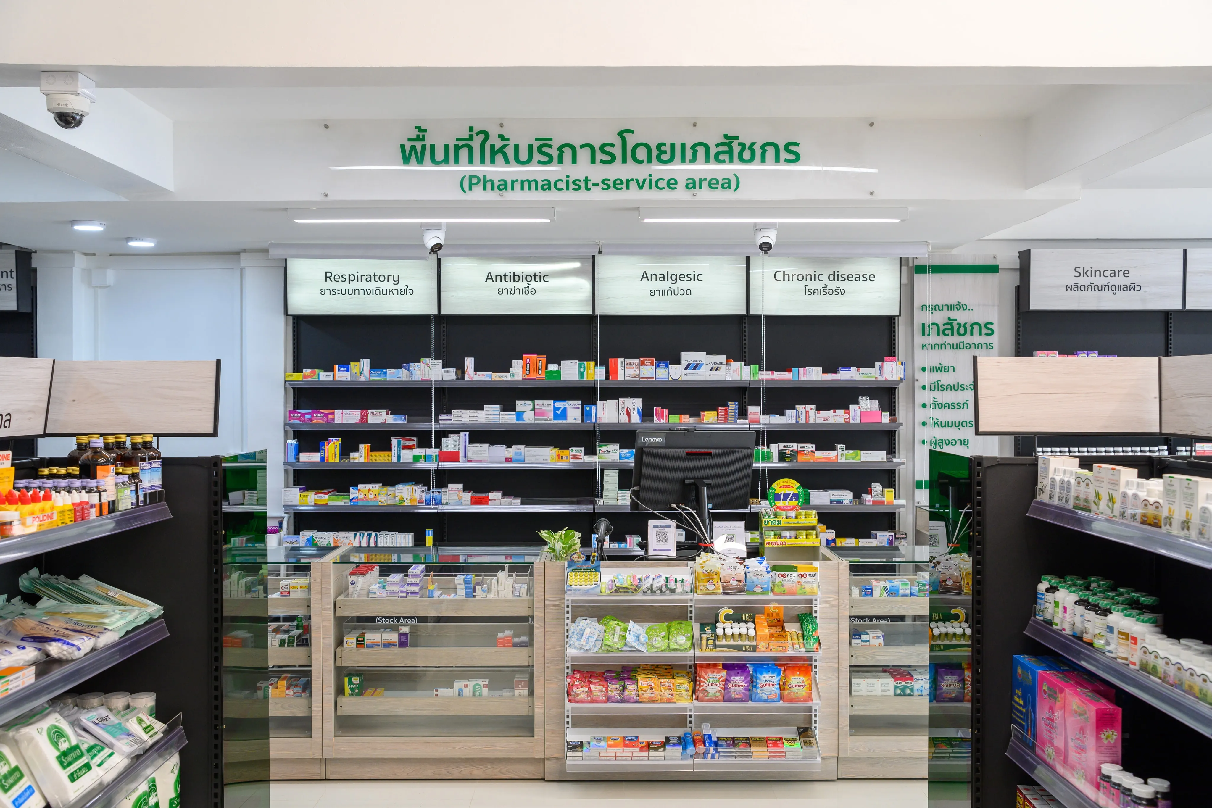 A pharmacy counter with neatly arranged shelves