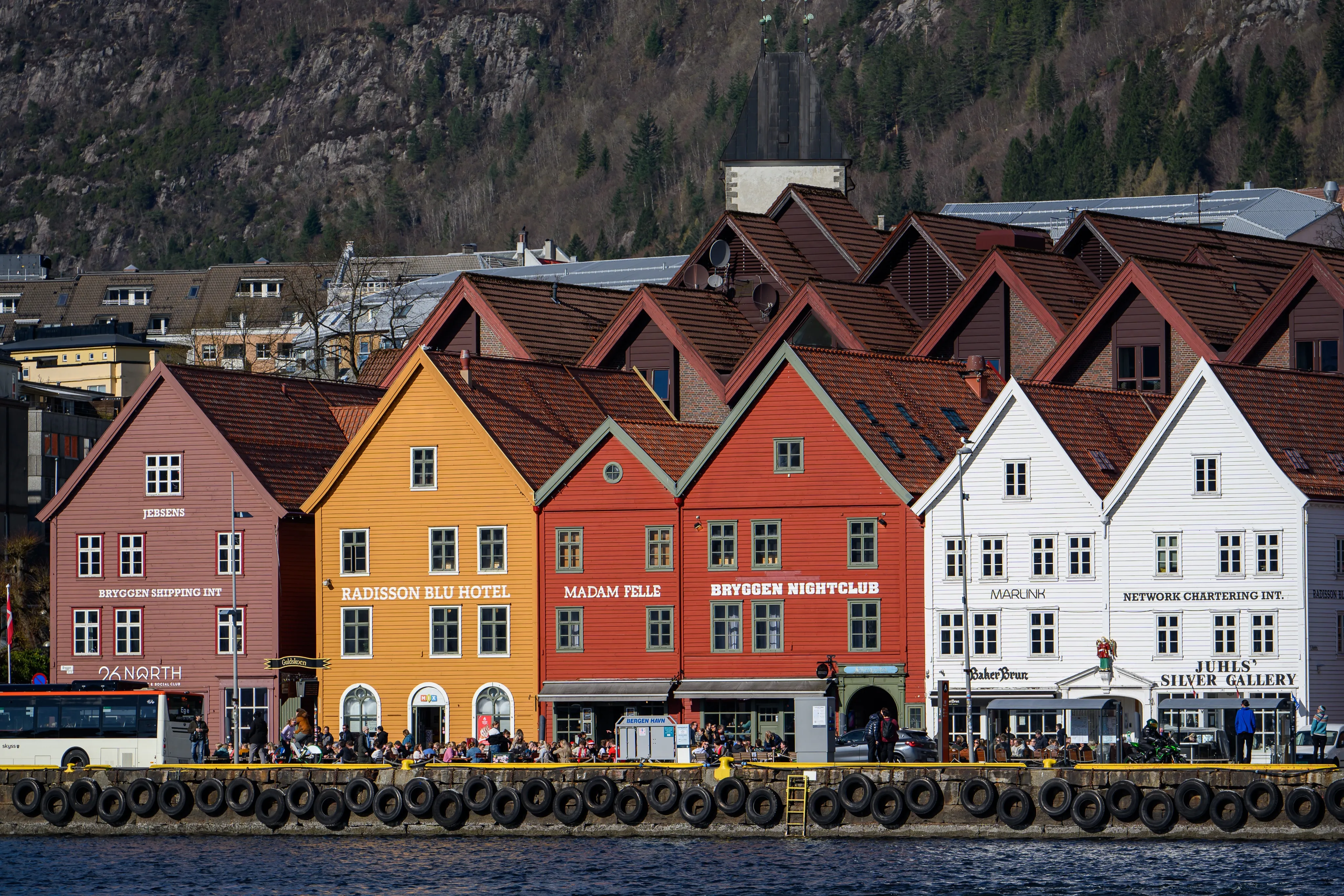 Colorful houses along a hillside harbor town