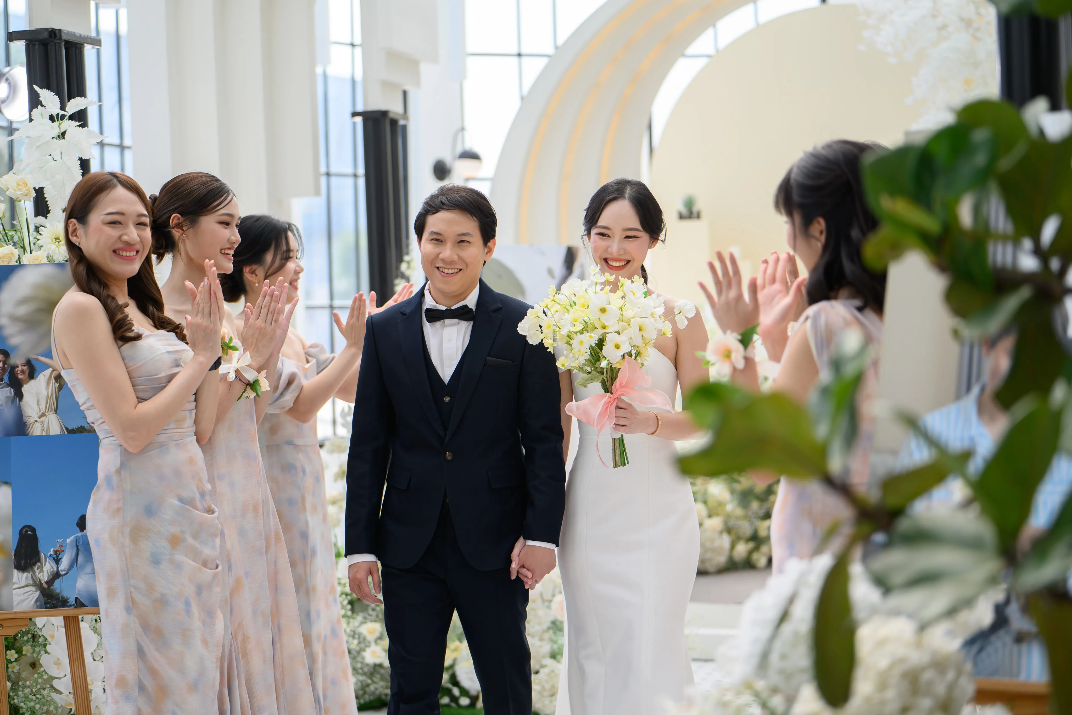 Wedding guests celebrating with the bride and groom