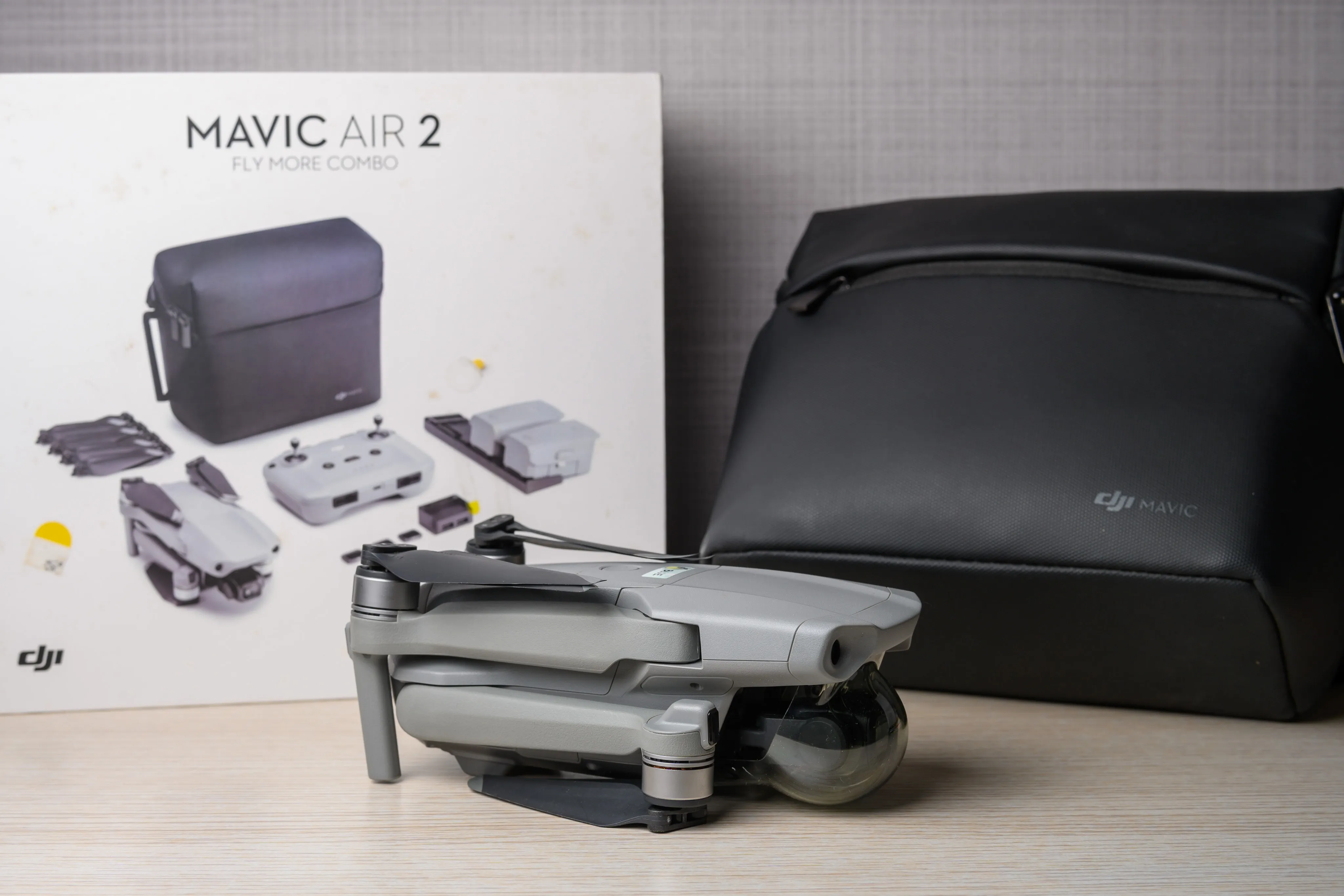 DJI Mavic Air 2 drone and accessories displayed beside its retail box