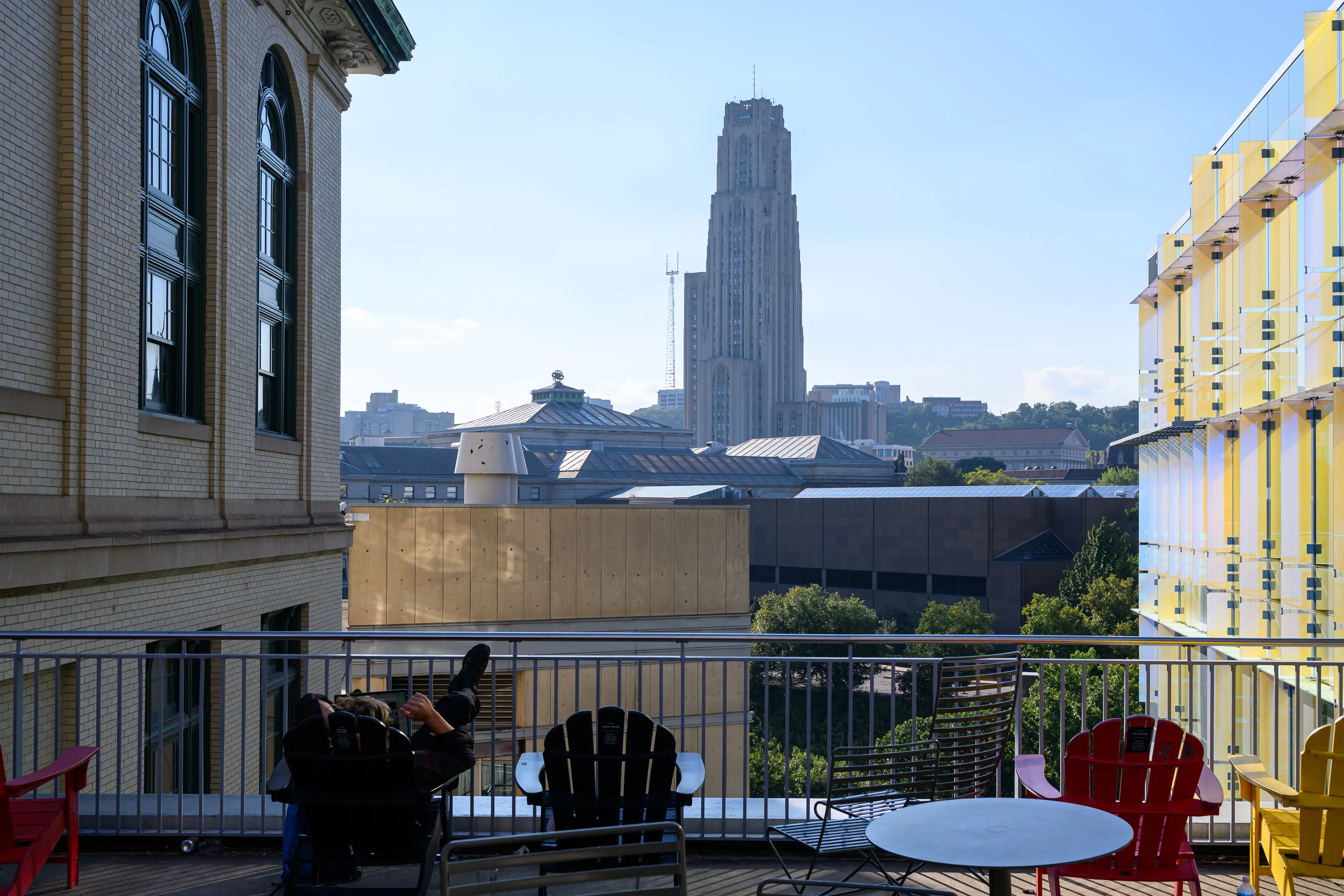 View from a colorful rooftop terrace toward the Cathedral of Learning in the distance.