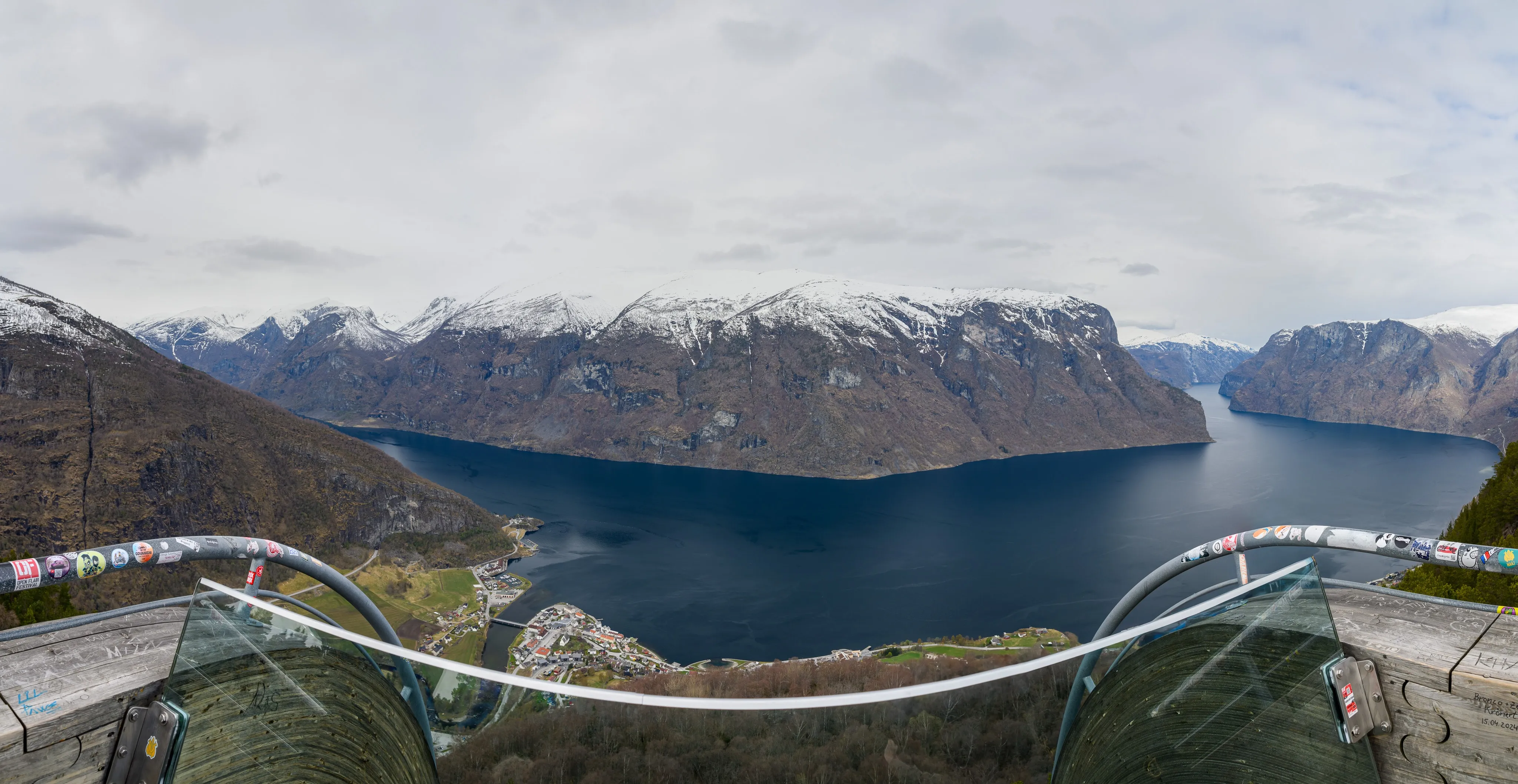 A mountain lake seen beyond a curved viewing platform