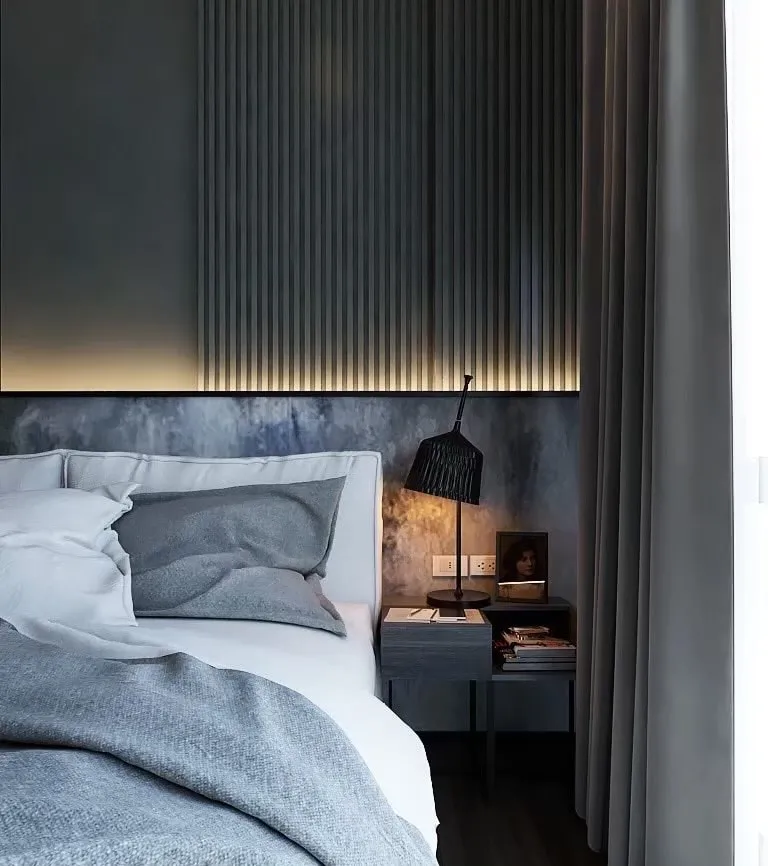 Architectural rendering of a dark modern bedroom with a close view of the bed and bedside lamp
